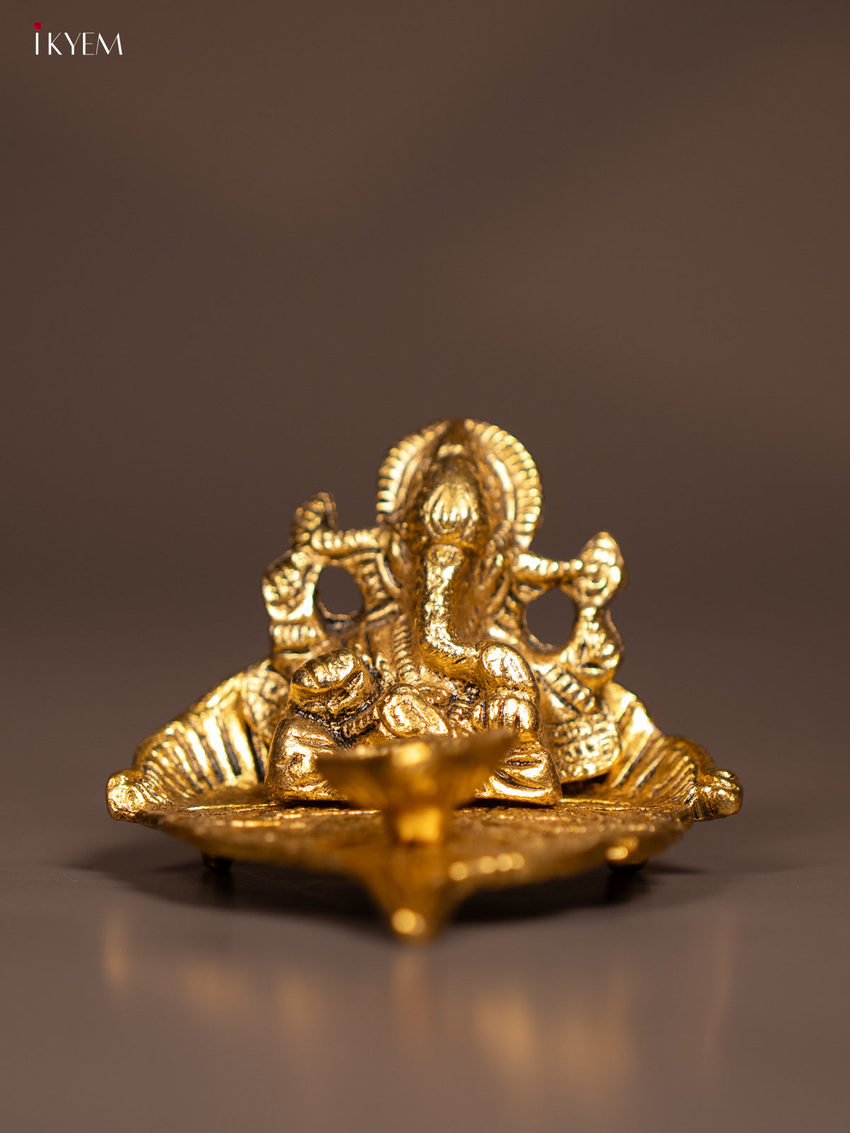 Magnificent Gold Plated Ganesha Idol & Diya In A Small Leaf