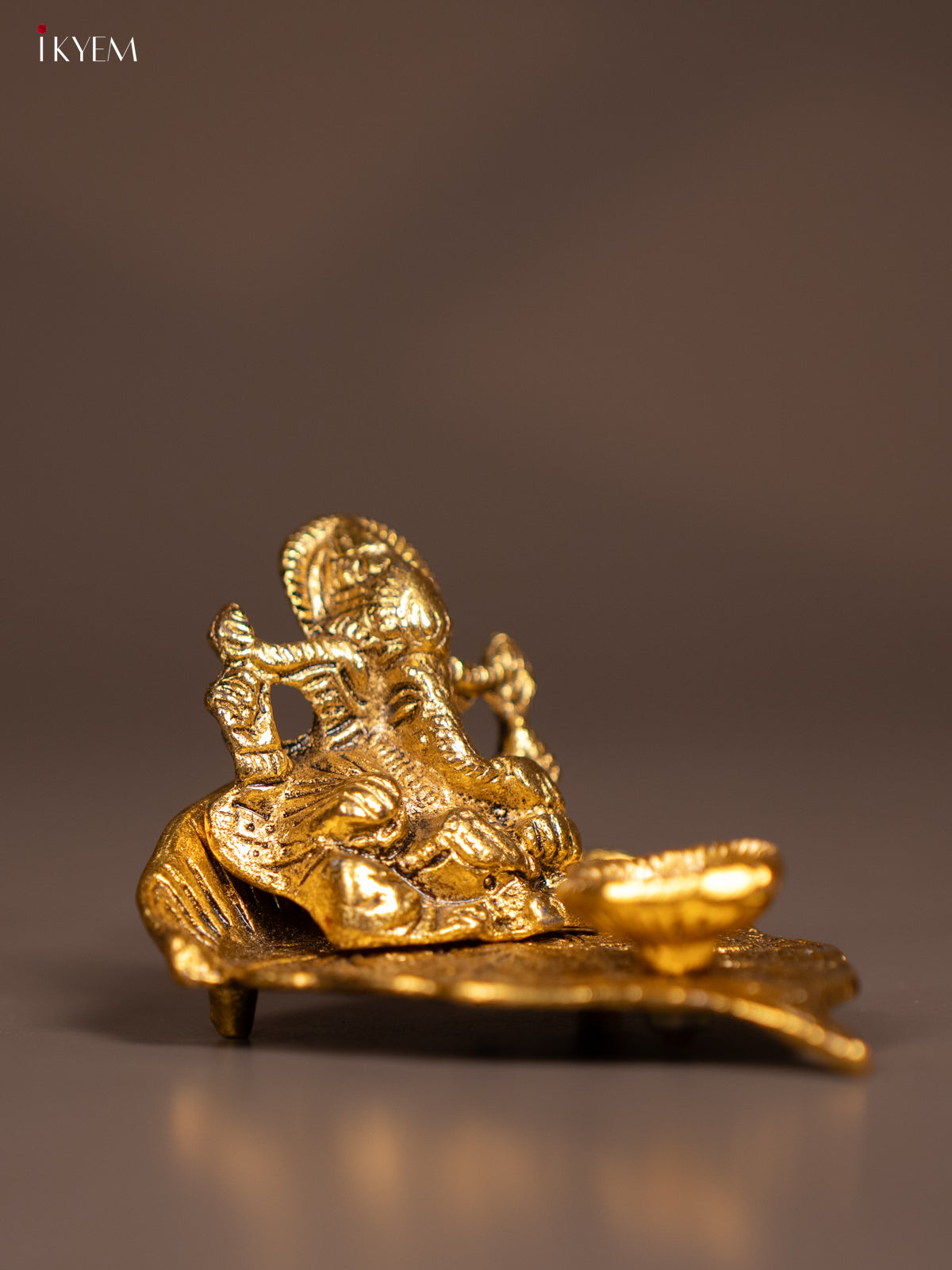 Magnificent Gold Plated Ganesha Idol & Diya In A Small Leaf 1